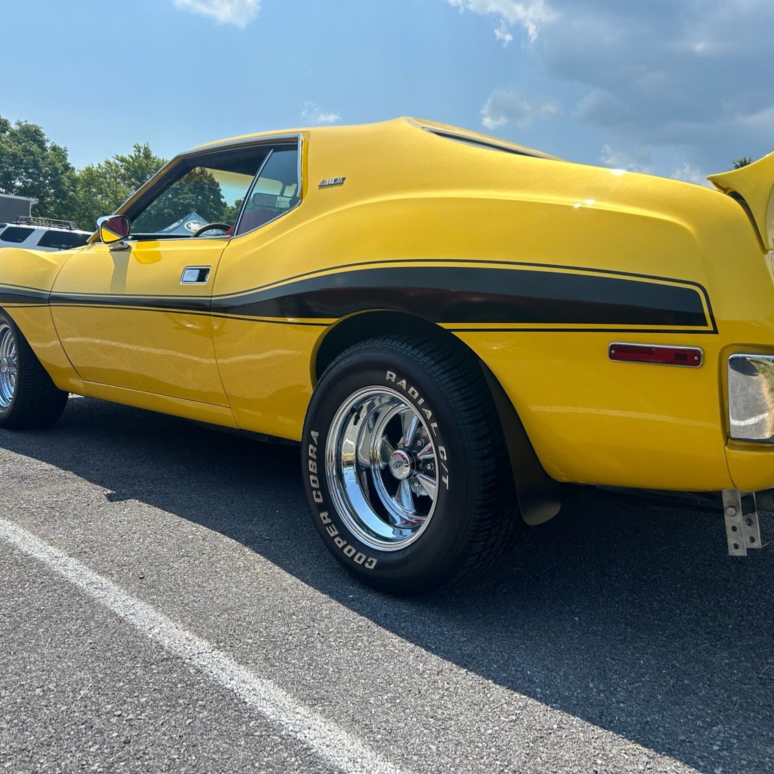 Yellow AMC Javelin classic muscle car after professional detailing